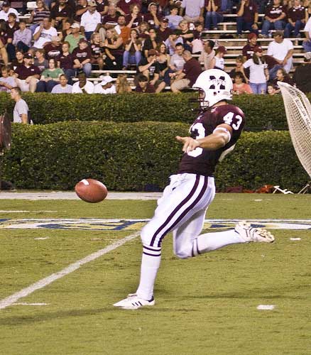 Mississippi State punter kicks the football